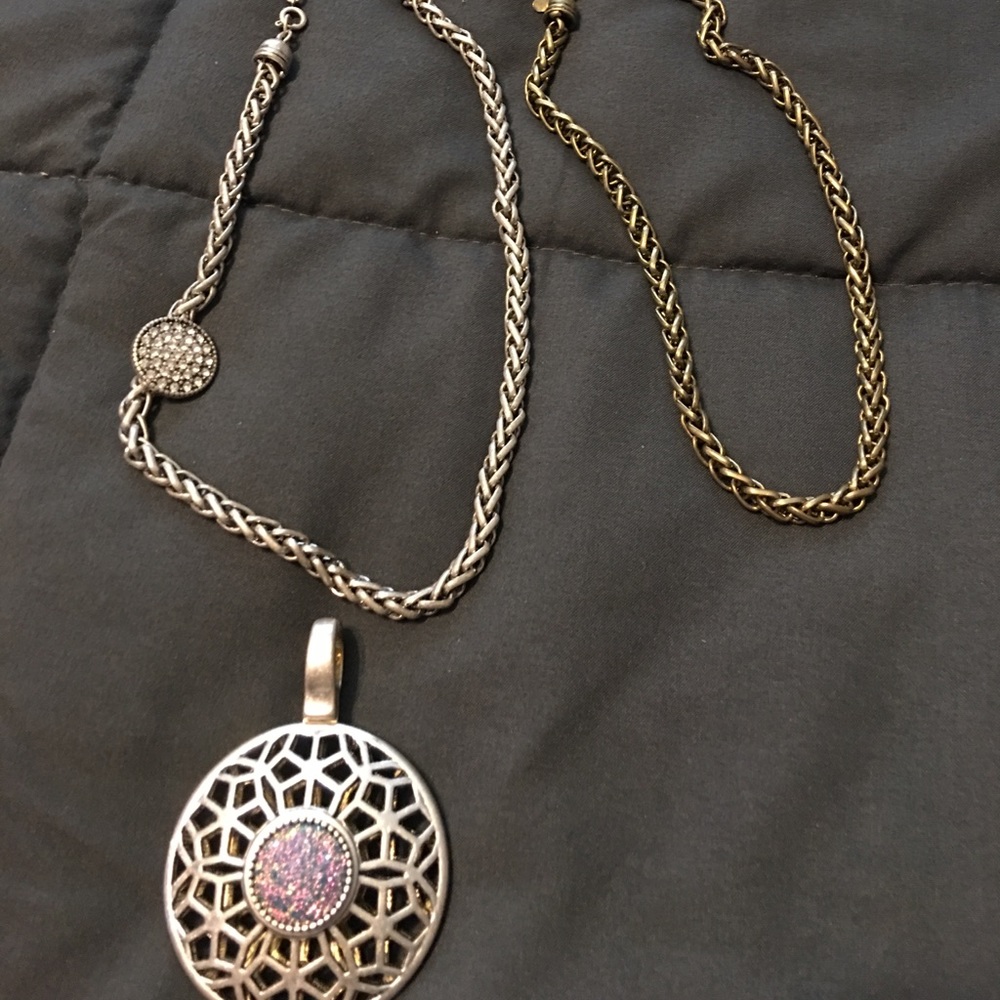 Two tone charm with matching necklaces.